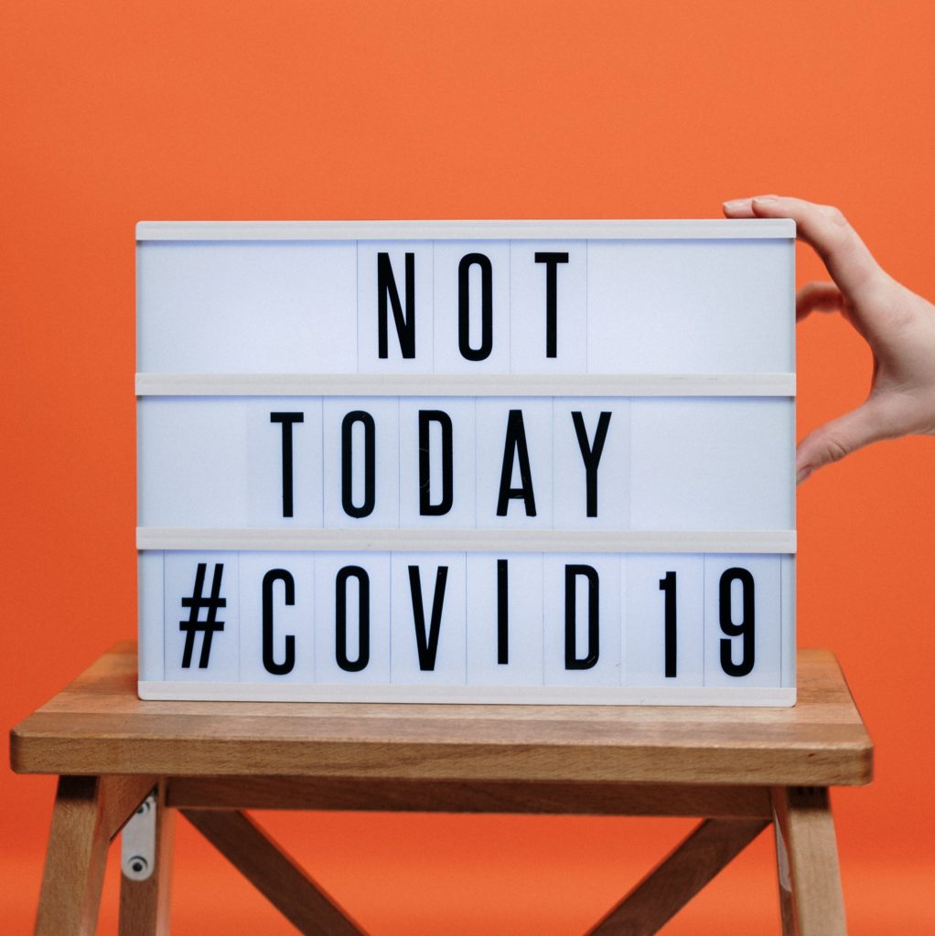 Covid19 sign on wooden stool