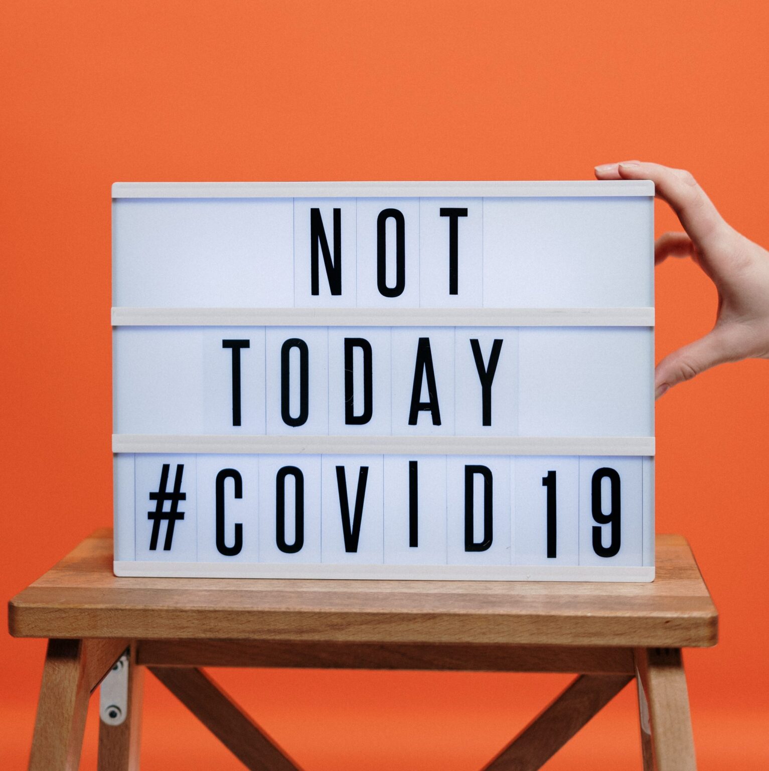 Covid19 sign on wooden stool