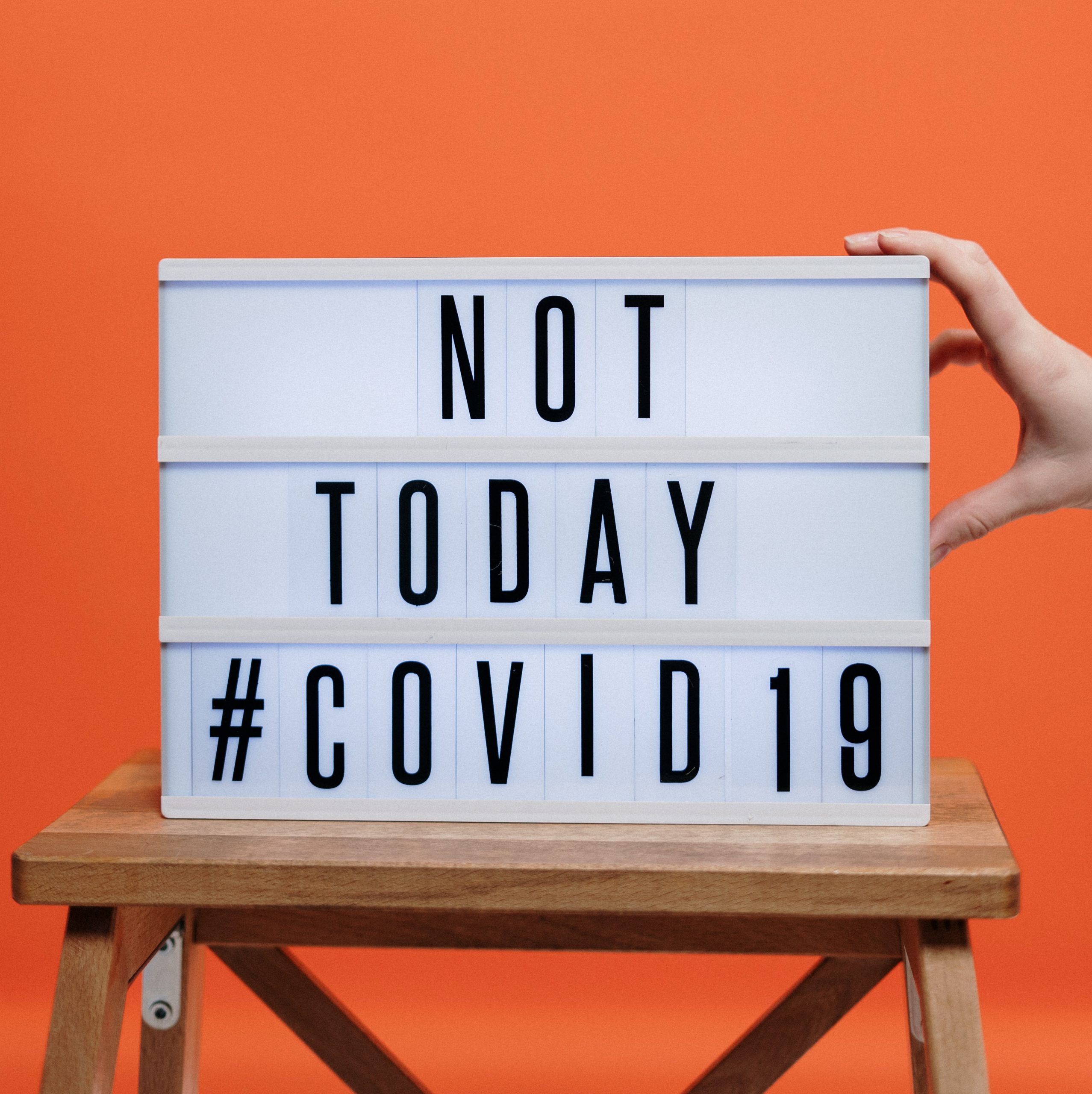 Covid19 sign on wooden stool