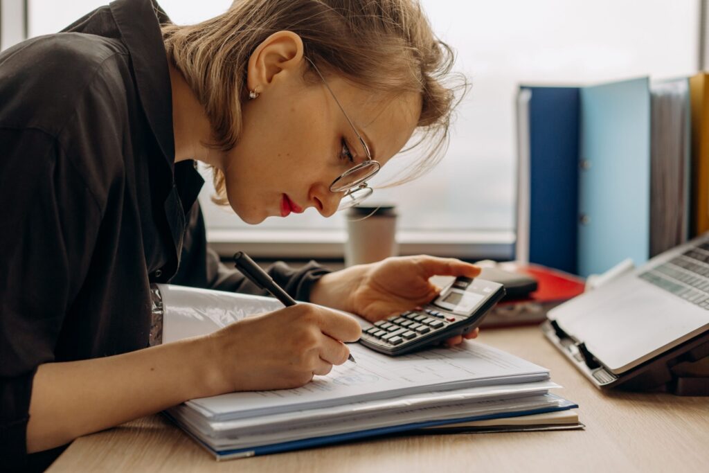 Woman reviewing a document at her desk